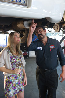 Image of AAMCO Mechanic Showing Customer car issue